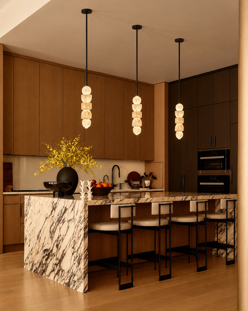 Group of arched globe pendant lights with alabaster-style glass shades and black rods