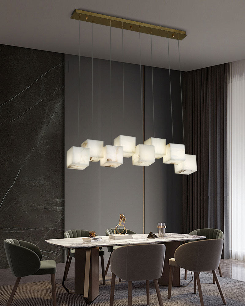 Modern white alabaster chandelier above a sleek rectangular dining table