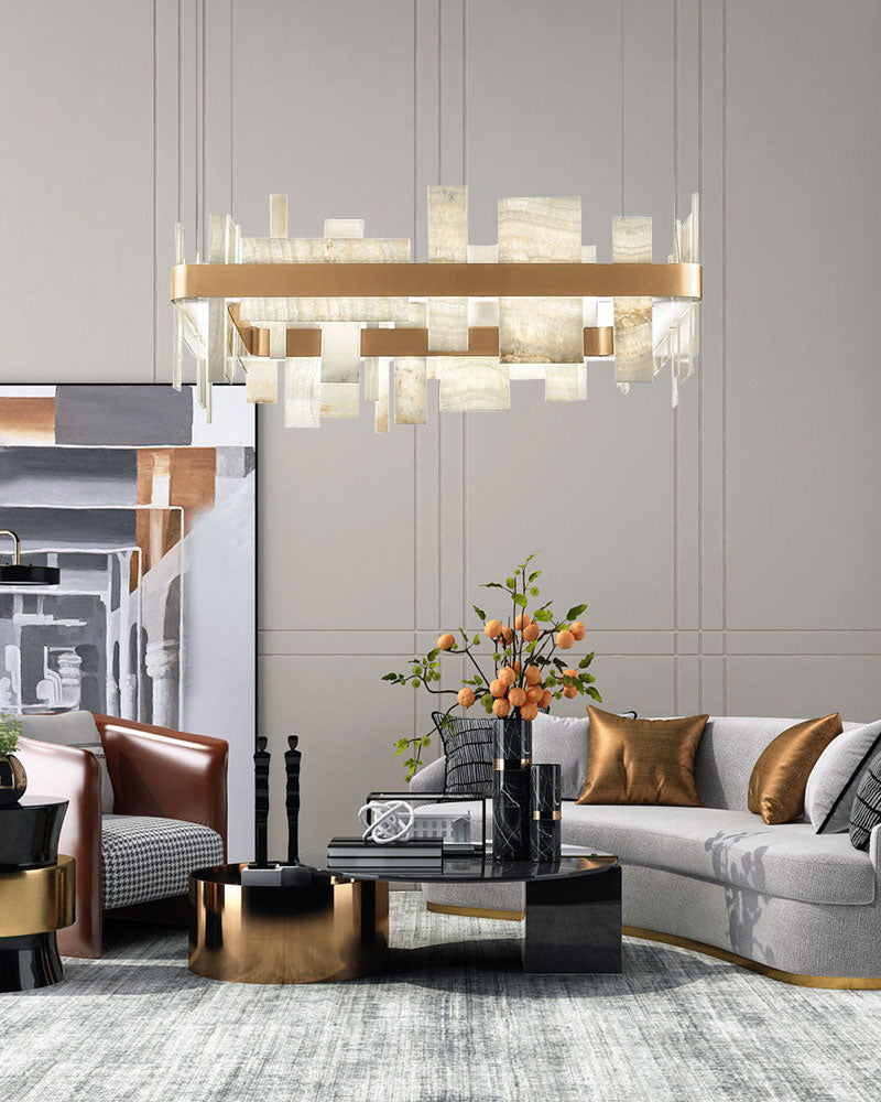 Marble slice chandelier above a sleek coffee table in a modern living room.