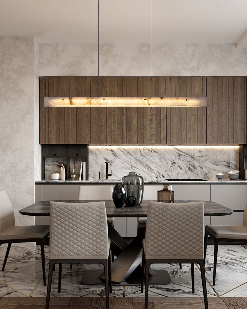 Nordic marble linear pendant light over a chic dining table in a modern kitchen