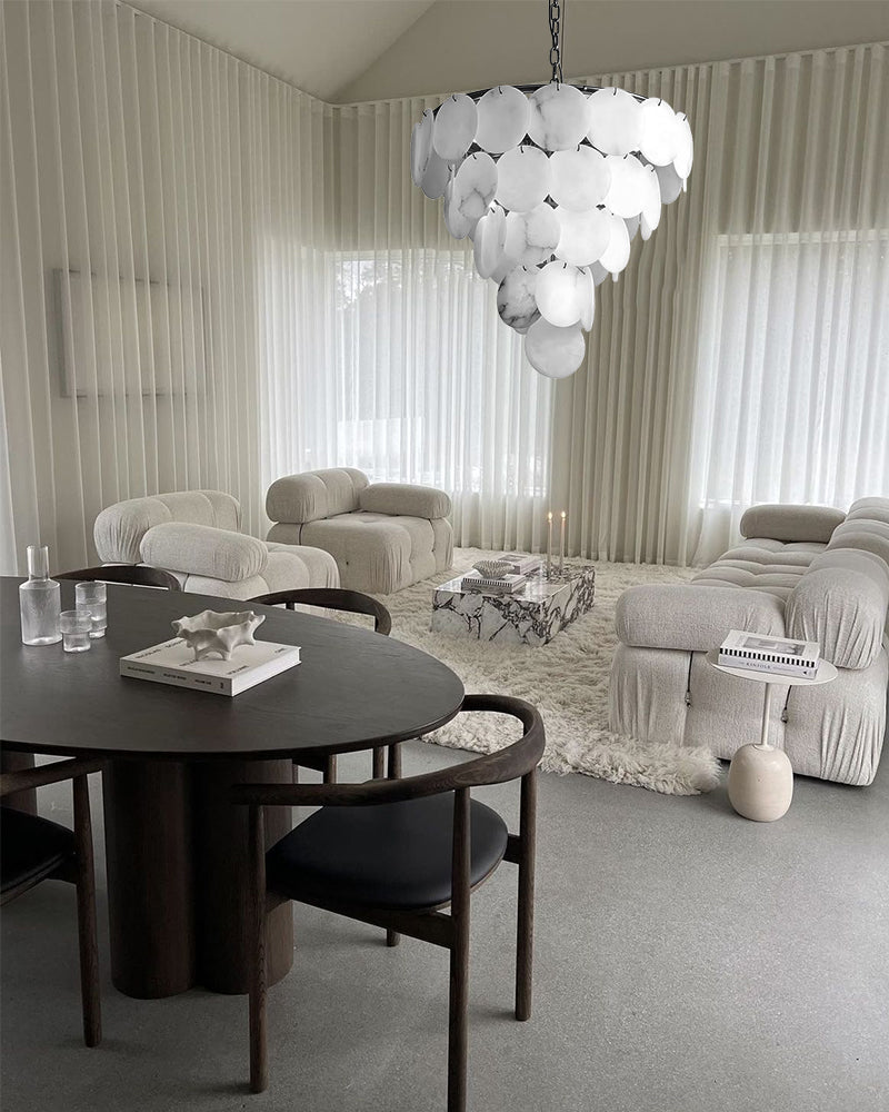 Tiered alabaster disc chandelier with rounded scalloped clusters and gold chain.