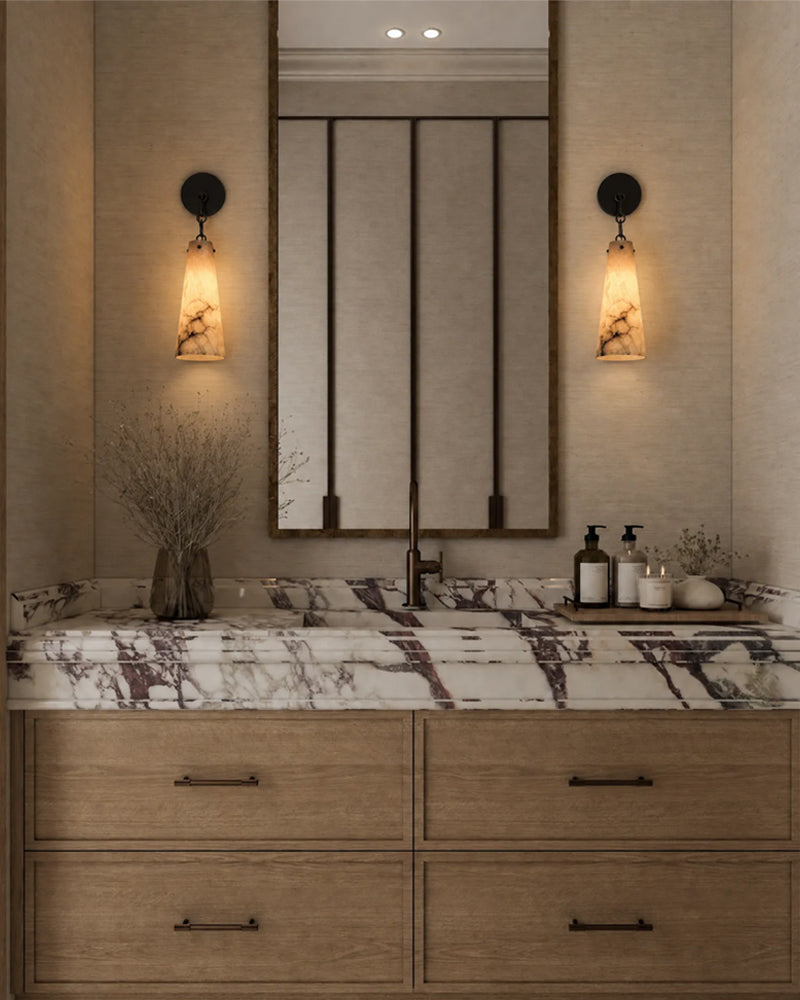 Alabaster conical wall sconce with metal backplate, warm glow