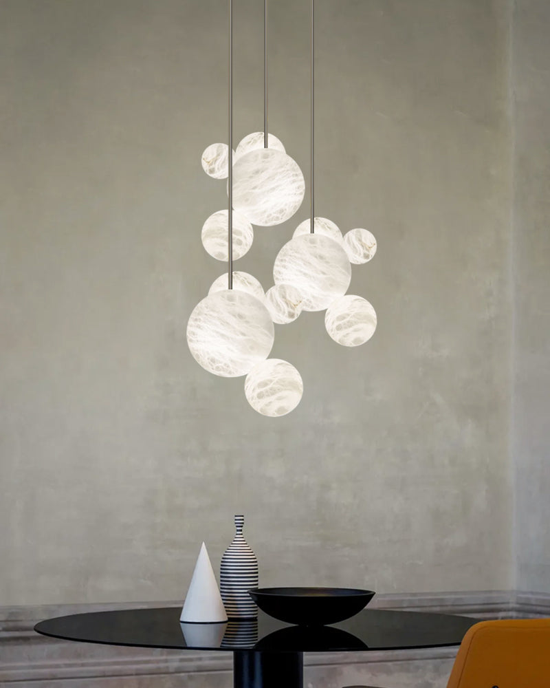 Cluster Alabaster Pendant Lamp with four different sizes of marble ball neatly supported on metal pole