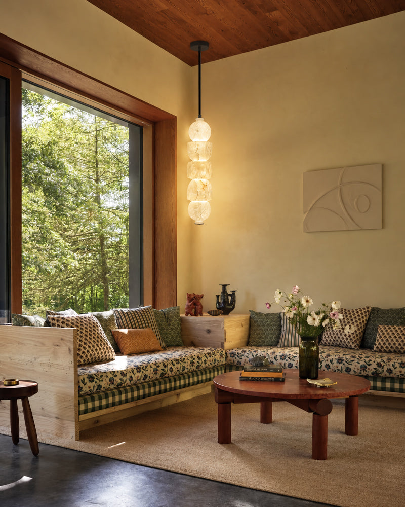 Globe pendant light with stacked alabaster-style glass shades and black ceiling mount