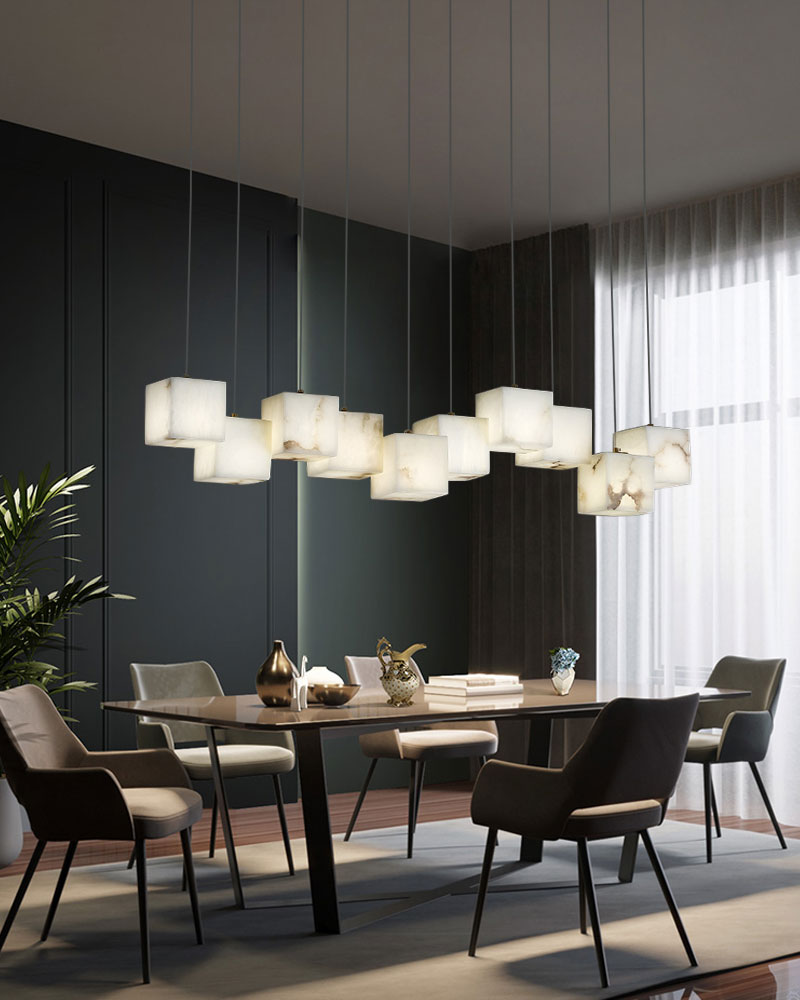 Stylish multi-cube white alabaster chandelier over modern dining table in elegant dining area.