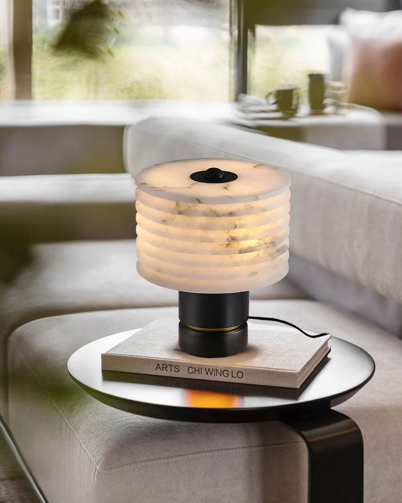 Modern G9 Cloud marble table lamp with alabaster shade on a sleek black side table