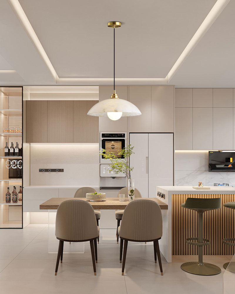 Elegant kitchen with round white pendant lamp over wooden dining table and chic seating.