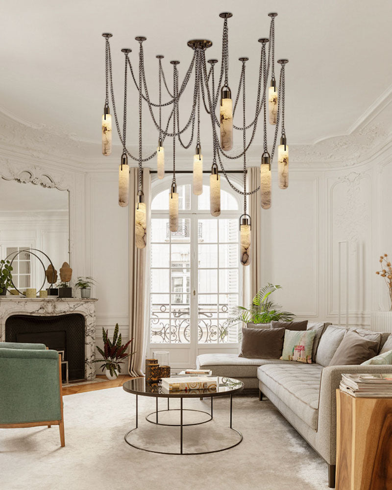 Brass LED pendant lamp in a bright living room with modern furniture and light decor.