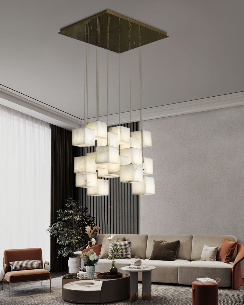 Modern square white alabaster chandelier above stylish couch in contemporary living room.