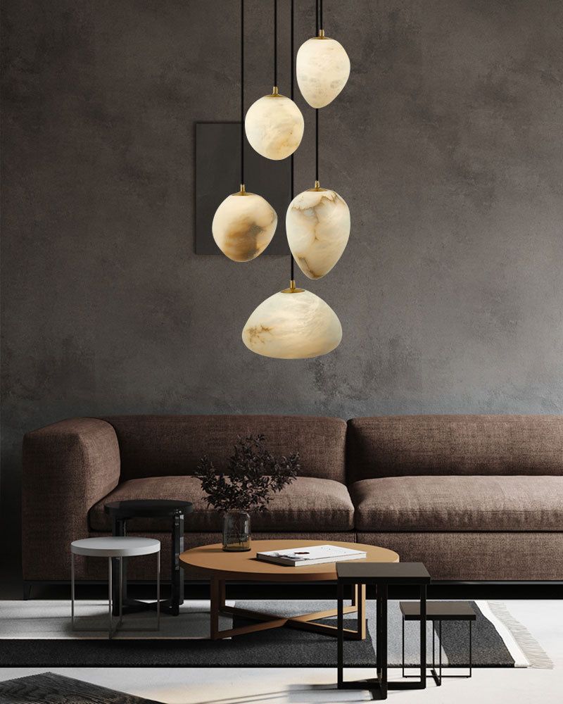 G9 Nature Alabaster Pebble pendant lights cascading over modern furniture.