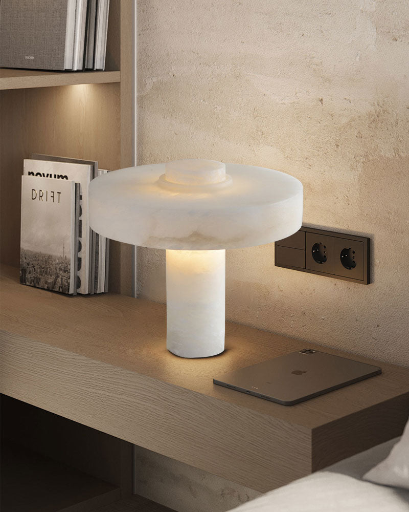 E27 alabaster marble table lamp on modern bedside table with warm light and books.