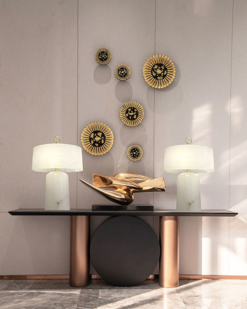 Stylish G9 cloud stone lamps on a black console table with gold decorative wall art.