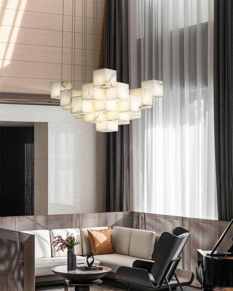 Contemporary white alabaster chandelier above a stylish modern seating area in living room.