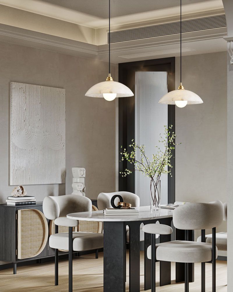 Stylish dining room with natural stone pendant lights and elegant round table design.