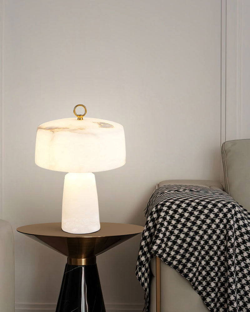 G9 cloud stone table lamp with gold accent on modern black side table.