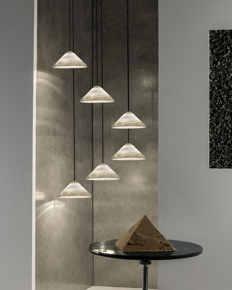 Alabaster white pendant lamps with conical shades in modern interior