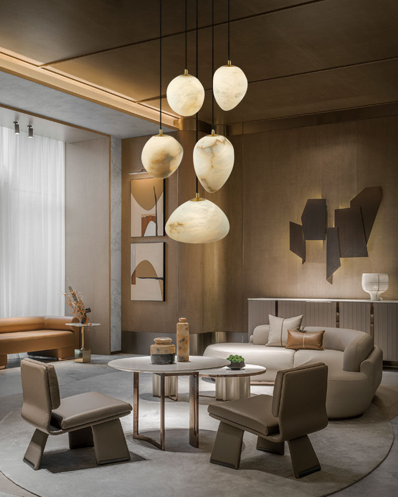 Modern living room with alabaster pendant lights and stylish furniture.