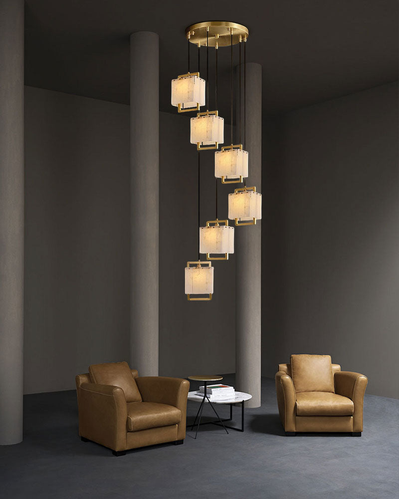 24-light cluster pendant lamp over brown armchairs in modern minimalistic living room.