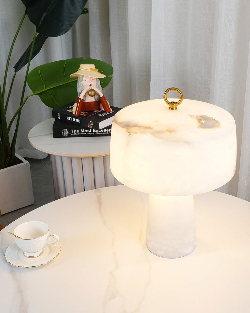 G9 natural cloud stone table lamp with copper accent on white marble table.