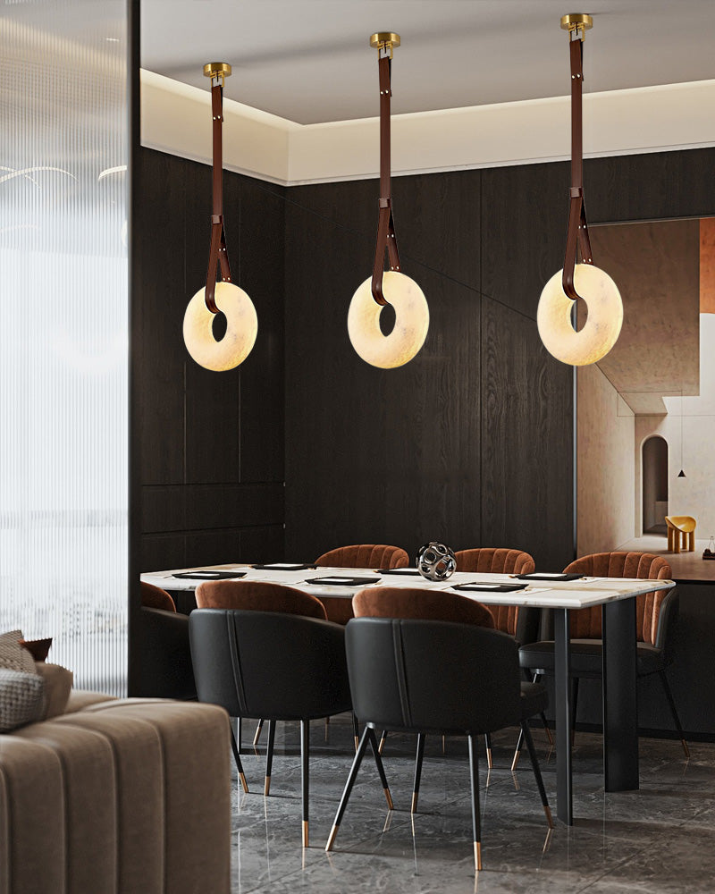 Modern dining area with alabaster LED pendant lamps and stylish furniture