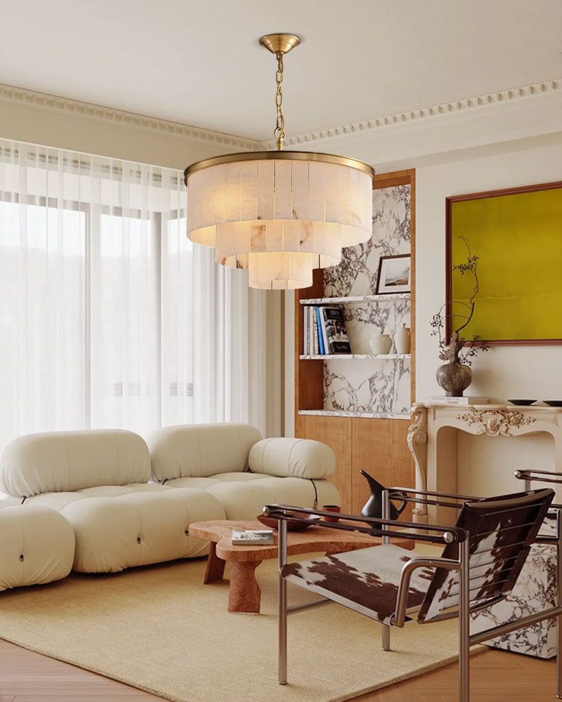 Brass and alabaster chandelier in stylish cream living room with modern furniture