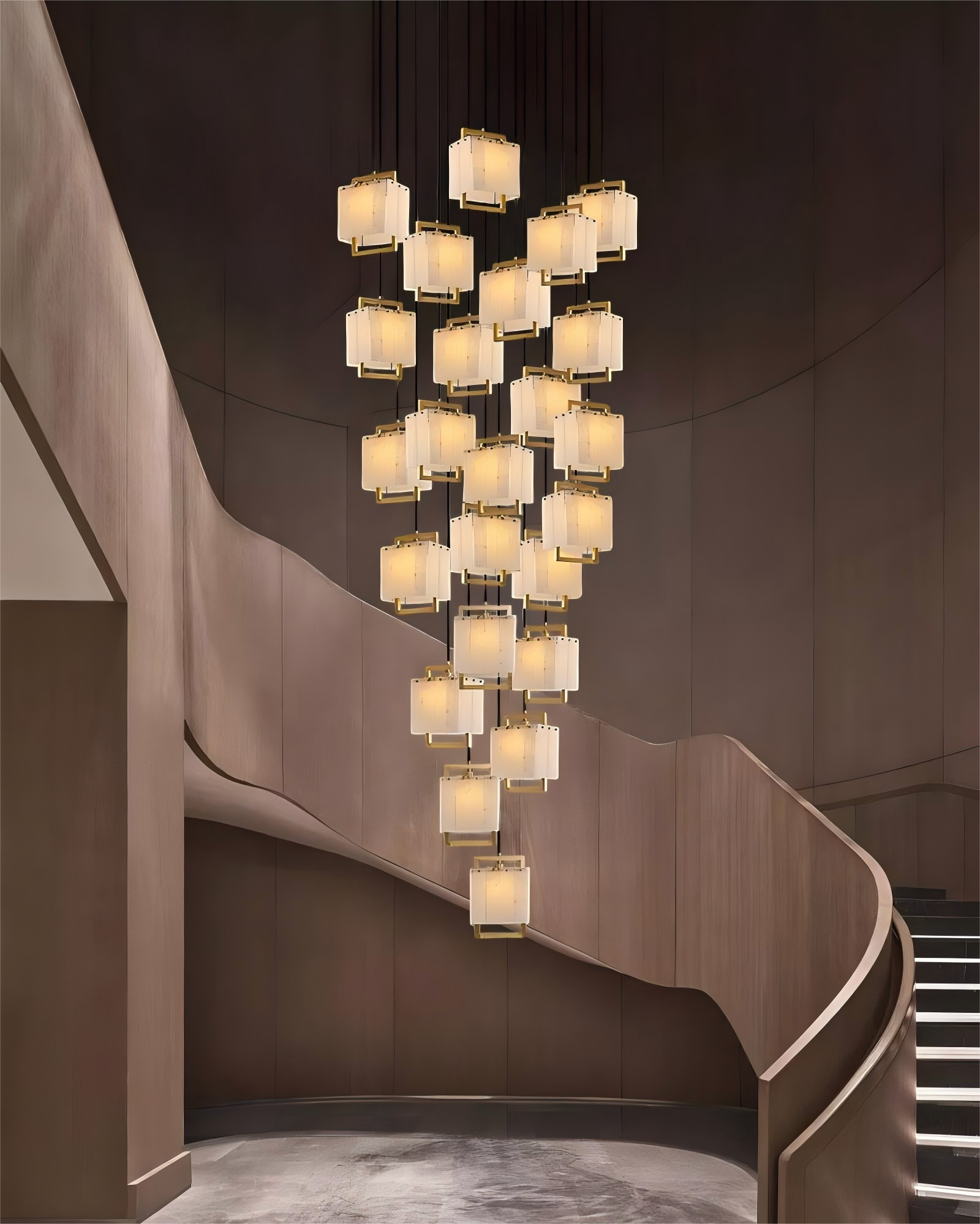 Cluster of rubbed brass alabaster pendant lights above stylish staircase