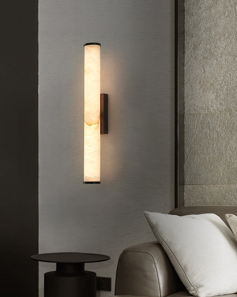 Cylindrical alabaster wall sconce lamp enhancing modern living space ambience