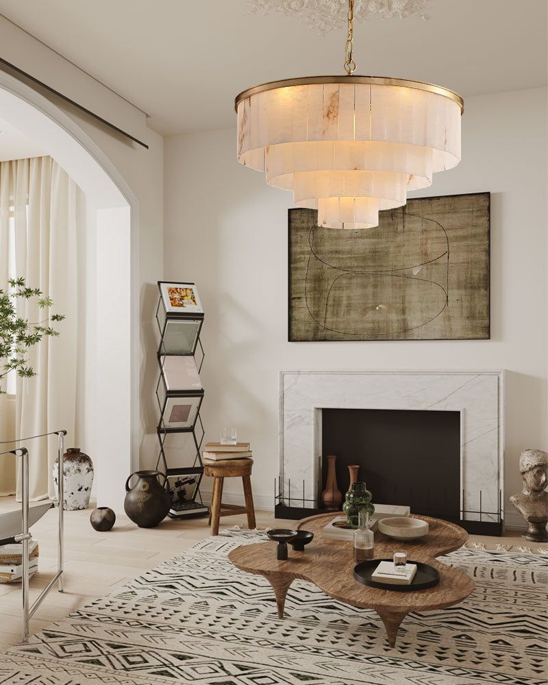 Elegant alabaster chandelier in a modern living room with cream furnishings and marble accents
