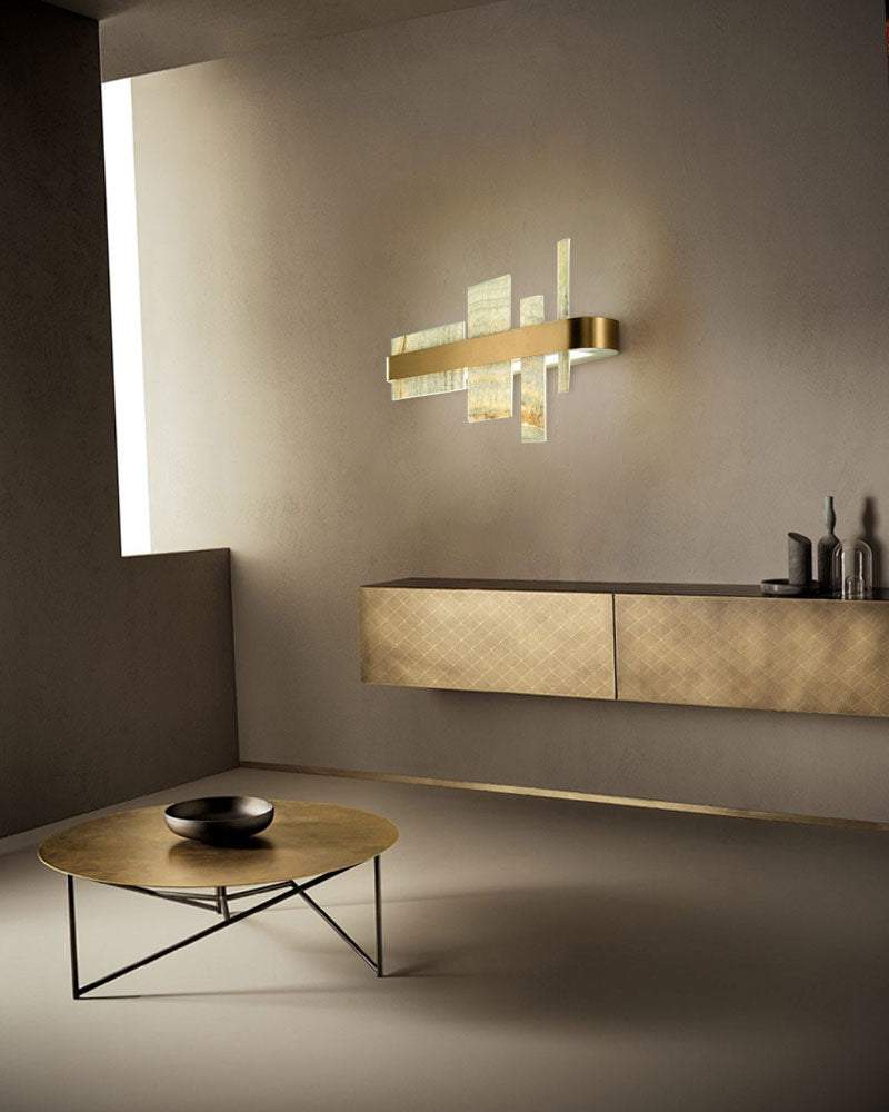Elegant marble and metal wall sconce brightening a chic modern interior