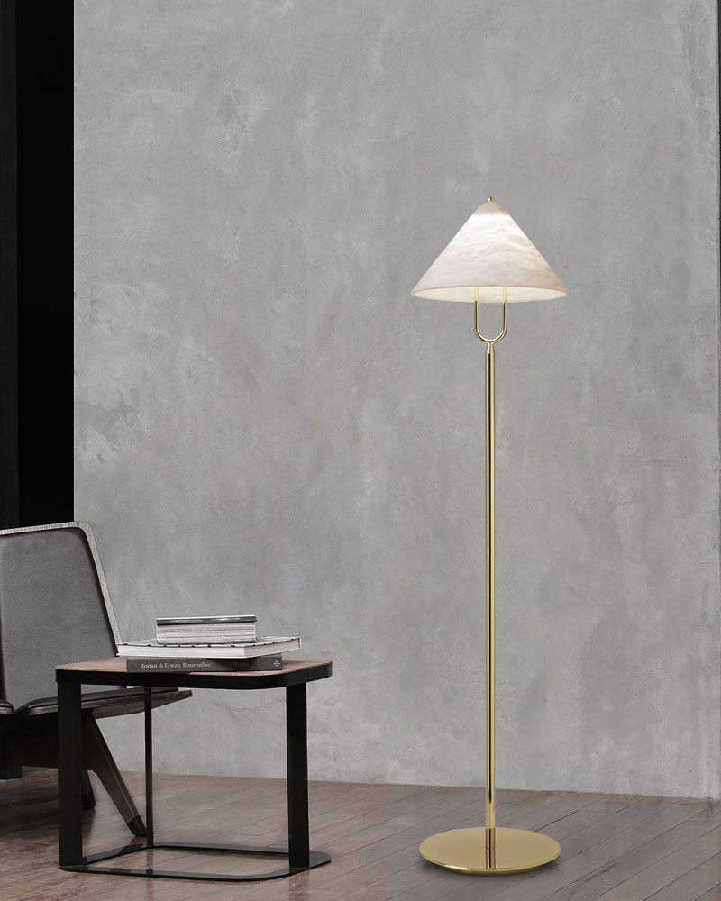 LED alabaster conical floor lamp with brass base in modern minimalist room