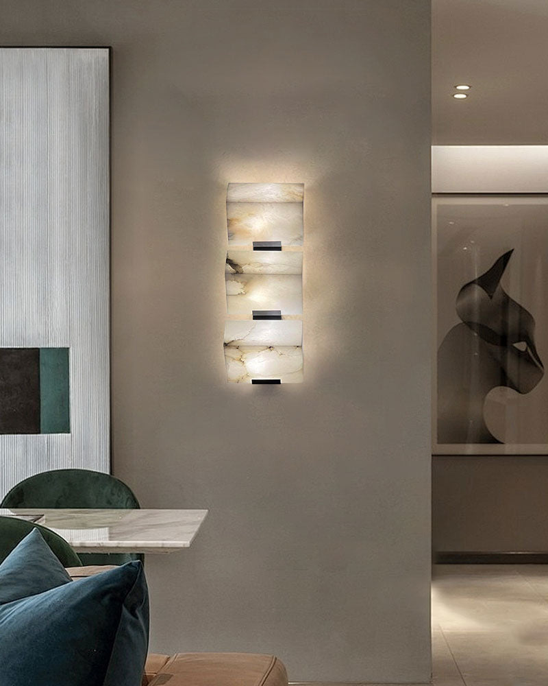 LED alabaster wall sconce in sloping design illuminating modern living space