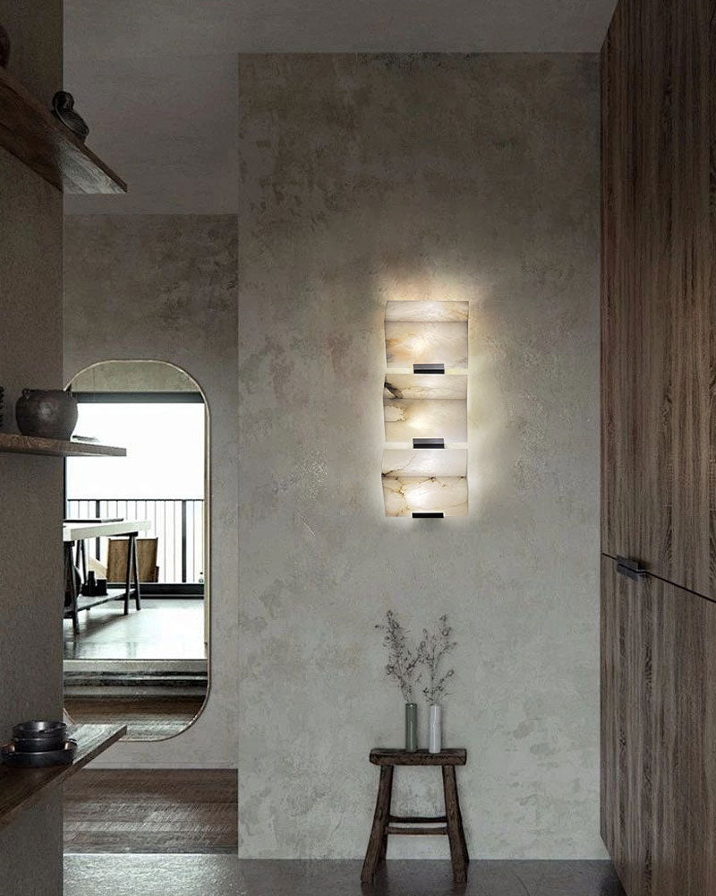 Minimalist LED alabaster wall sconce with geometric design in modern interior setting