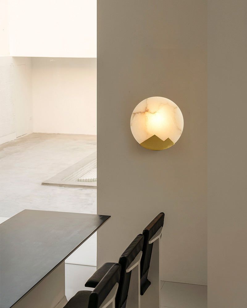 Nordic alabaster marble LED wall sconce with mountain design illuminating modern interior