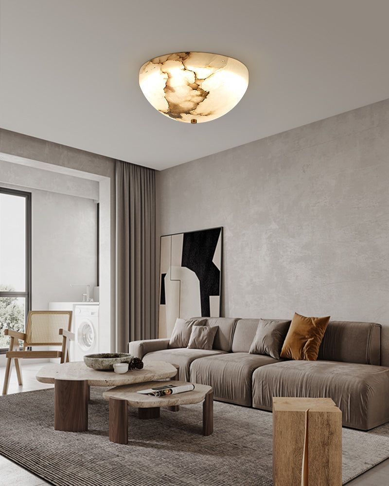 Round alabaster ceiling lamp illuminating a chic modern living room