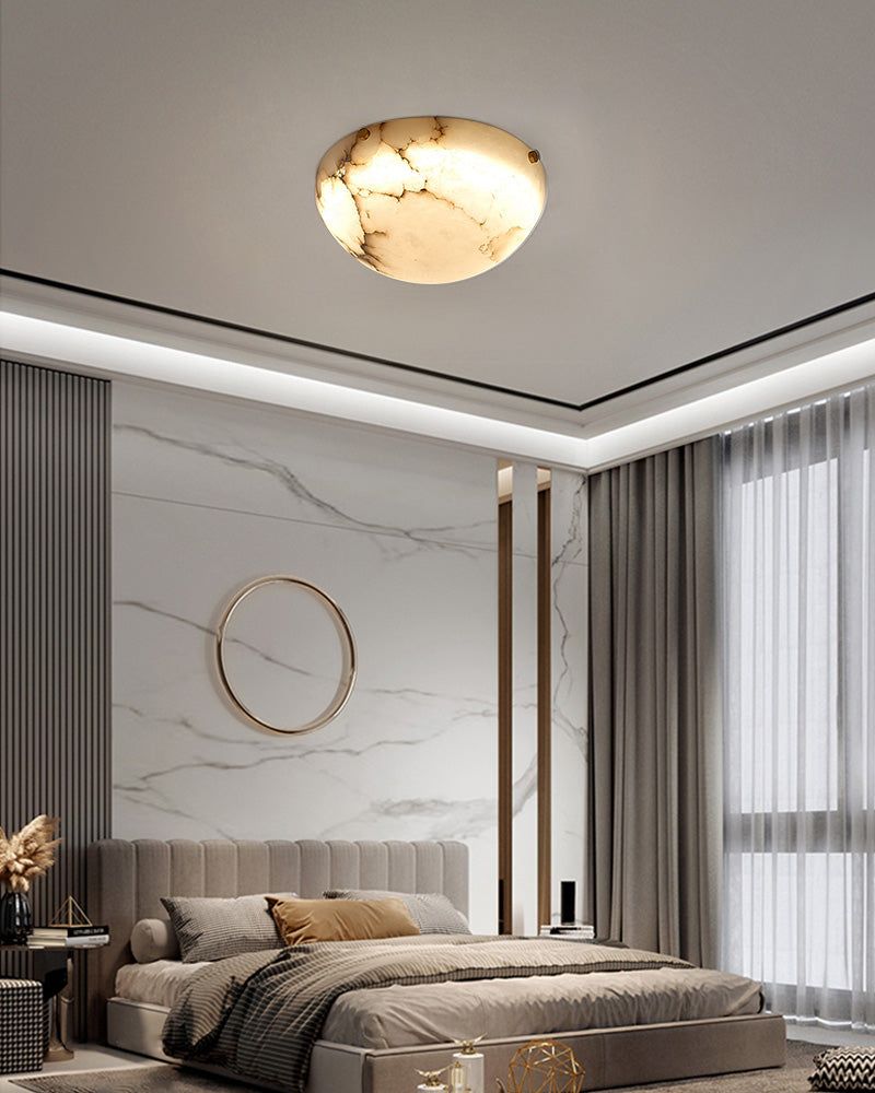 Round alabaster ceiling light in a modern bedroom with contemporary design