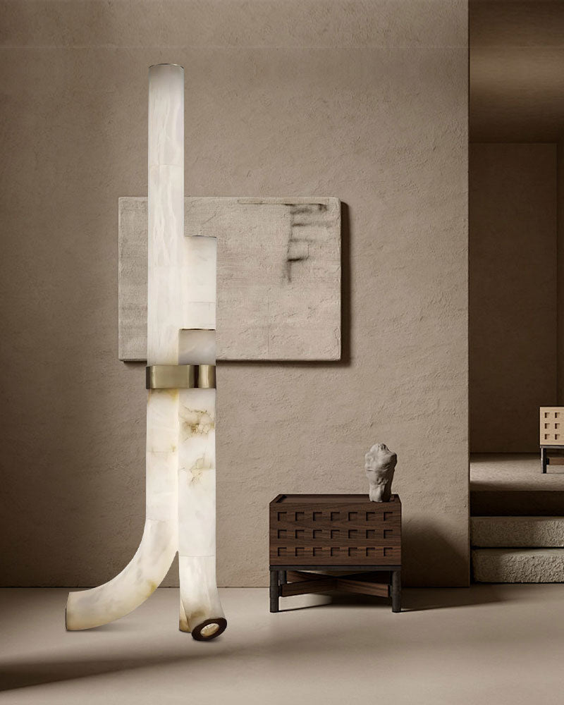 Sleek alabaster floor lamp with geometric design illuminating a stylish interior