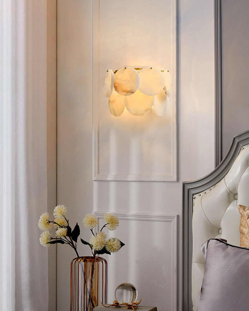 Spanish Alabaster Shell flush mount sconce illuminating a refined bedroom