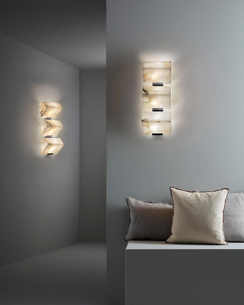 Stylish LED alabaster wall sconce with sloping blocks in modern interior setting