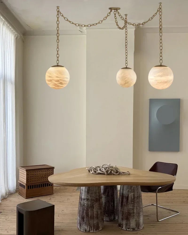 LightsStory Series Ethereal Chandelier | Globe Hand-Carved Natural Alabaster, Brass and Black finish for Grand staircases, high ceilings, and modern entryways Modern Pendant lamp