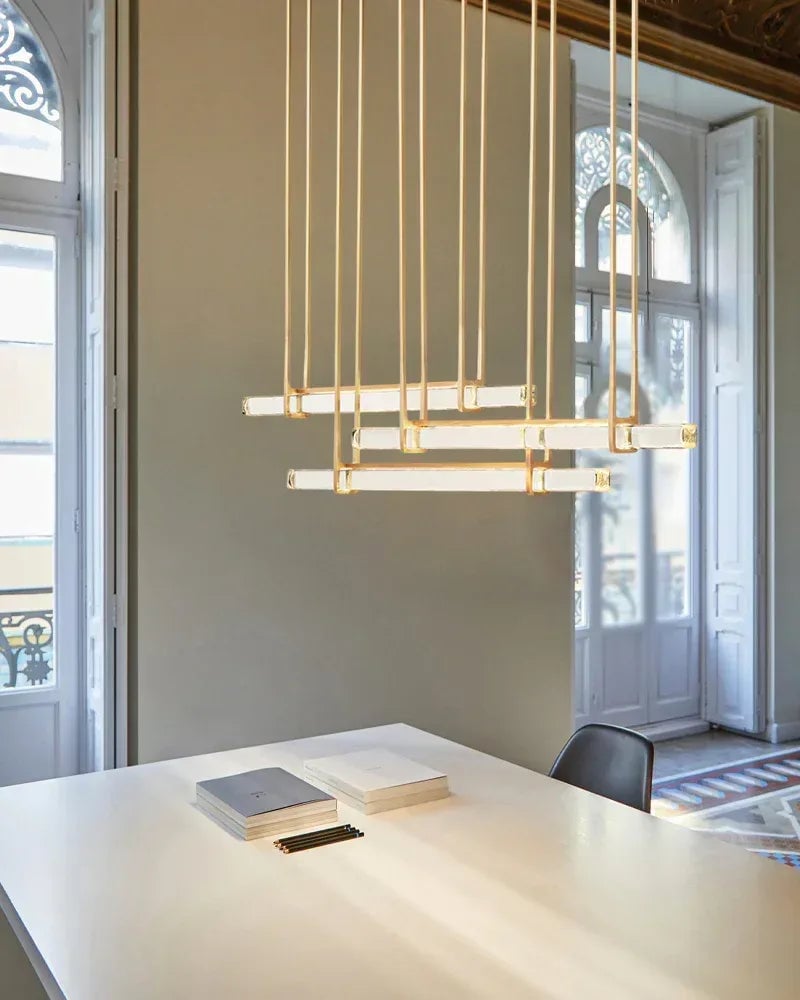 Valence Series Prismatic Chandelier | Vertical Brass Drops Meticulously crafted clear prisms and structural brass, Warm metallic brass finish for Dining Rooms and Living Areas American chandelier